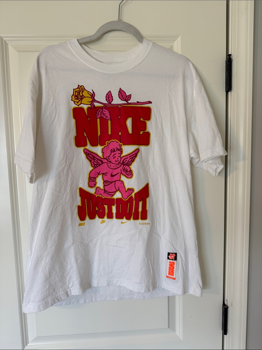 Nike White Short Sleeve Tee with Pink Cherub & Red 'JUST DO IT' Graphic